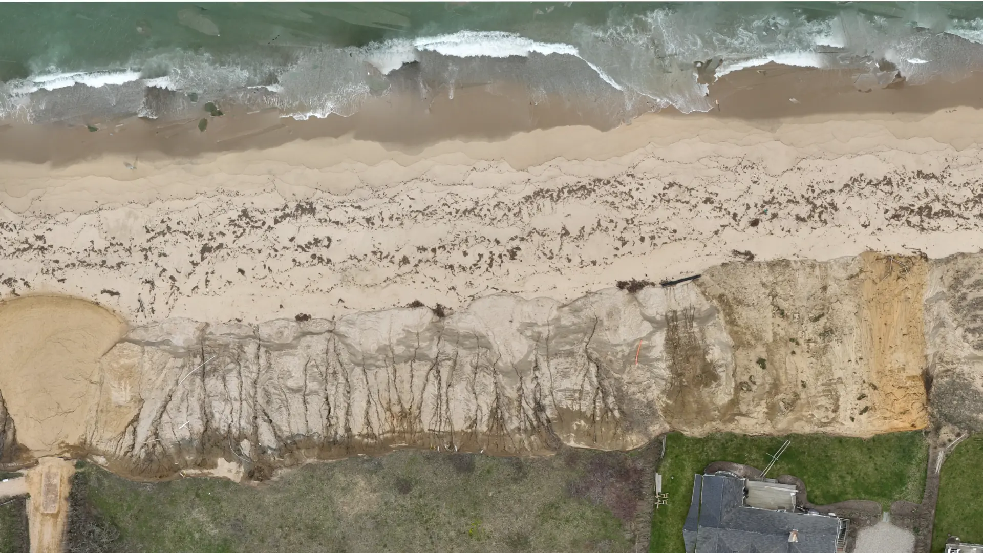 Aerial orthomosaic-style overview of a Nantucket coastal edge and nearby property context